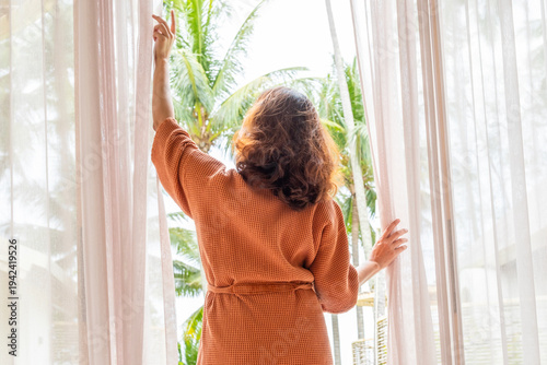 The woman was at the window in the bedroom. She opened the curtains on the window. In the morning and she looks at the view of mountains and trees at sunrise.
Free Download The woman was at the window in the bedroom. She opened the curtains on the window. In the morning and she looks at the view of mountains and trees at sunrise.
- GFXLoad