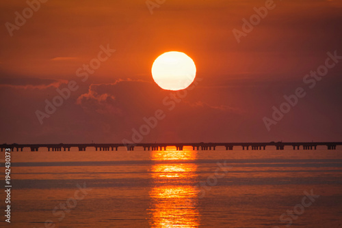 Lake Pontchartrain Causeway twin span bridges seen at sunset from Mandeville, Louisiana