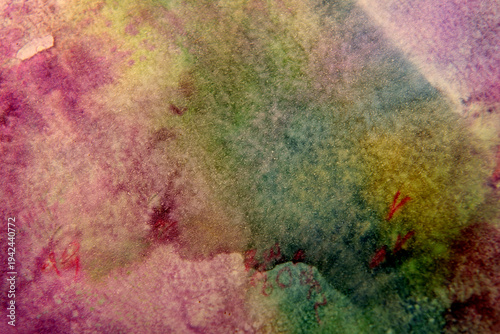 
Dark background of stains on multi-colored paper
