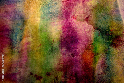 
Dark background of stains on multi-colored paper