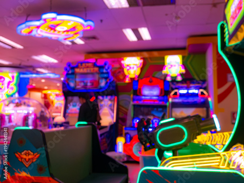 Interior view of colorful arcade game center with neon lights and gaming machines, vibrant entertainment zone