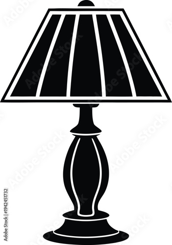 Black silhouette of a classic table lamp with a paneled shade and ornate base isolated on white