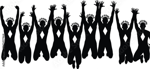 Silhouette of a group of people jumping with their arms raised