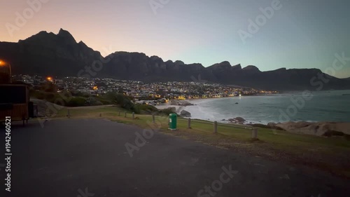 A panoramic view of Camps Bay at dawn with the Table Mountain and 12 Apostles Mountain range in the background. Camps Bay, Cape Town, South Africa.