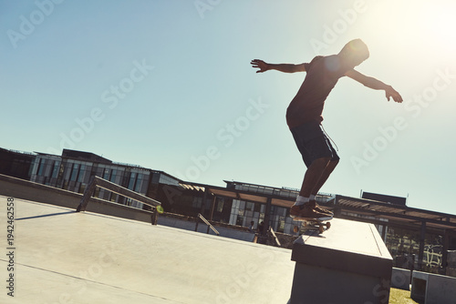 Skateboard, action and man in city, trick and training for technique, lens flare and hobby. Balance, skater and person with practice, space or challenge for extreme sports and talent in New York