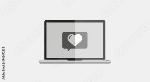 Laptop displaying heart icon in speech bubble on screen