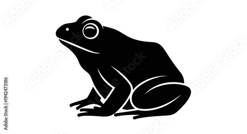 Minimalist black frog sitting in profile on white.