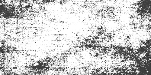 Vintage grey grunge wall background featuring a dirty stone texture with black ink paint effects and a dusty paper surface design