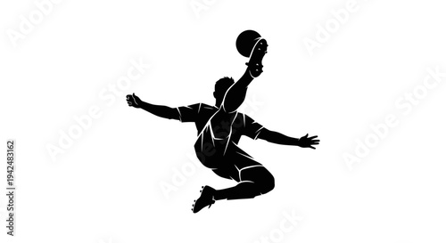 Silhouette of a soccer player kicking a ball in mid-air, dynamic action shot