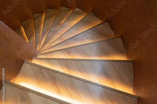 curve wooden stair steps with light background and texture. luxury home interior concept.