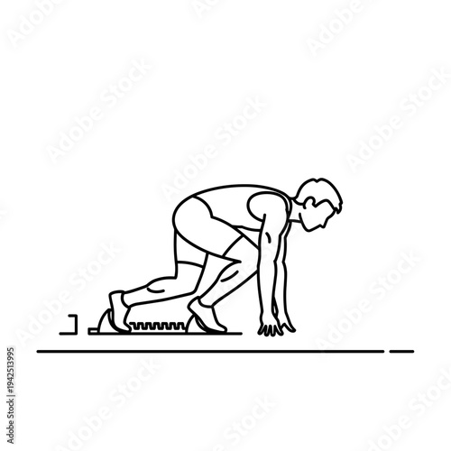 Male athlete preparing for sprint start on track with starting blocks  