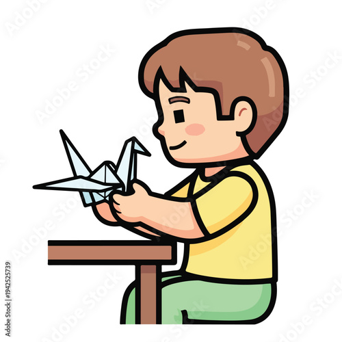 Boy making origami crane at desk childhood creativity concept