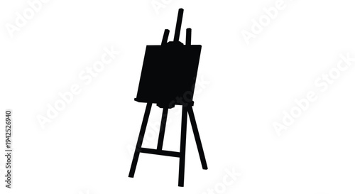 A black silhouette of an artist s easel with a blank canvas
