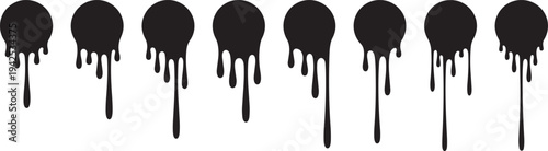 Black paint drips on white.