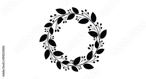 A circular wreath of delicate black leaves and small berries