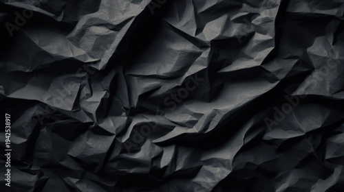 Abstract dark crumpled paper texture for backgrounds and design elements