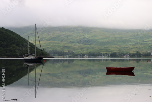 Wallpaper Mural Reflections of boats and a green misty hillside on a still sea loch Torontodigital.ca