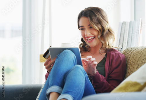 Obraz na płótnie Laugh, credit card and woman with tablet in house for relax, streaming service or online shopping