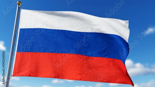 A tri-colored flag waves gently against a bright blue sky with clouds