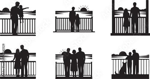 Silhouettes of families and couples standing on a bridge during sunset