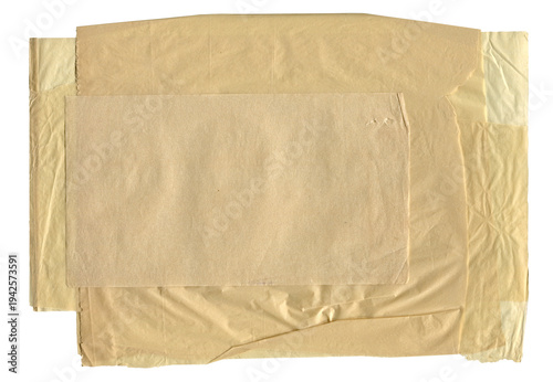 Stack of vintage yellow crumpled packing paper sheets isolated on white