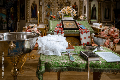 Obraz na płótnie Traditional ceremonial setup with silver bowl and books in elegant classic inter