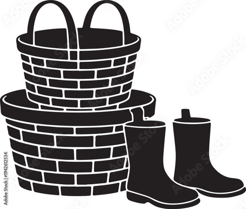 Two woven wicker baskets stacked with pair of waterproof rubber boots for gardening