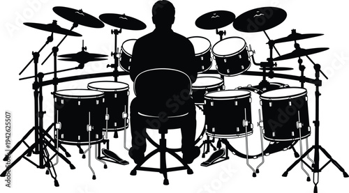 Back View Silhouette of a Professional Male Musician Playing a Large Acoustic Drum Kit with Multiple Cymbals and Percussion Instruments