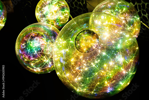 Glowing, vibrant LED spheres illuminate a dark space