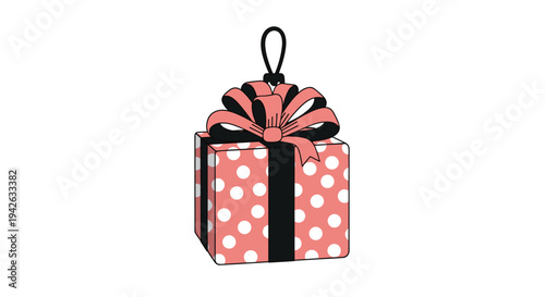 Pink polka dot gift box with large black and pink bow designed as a festive Christmas hanging ornament on white.