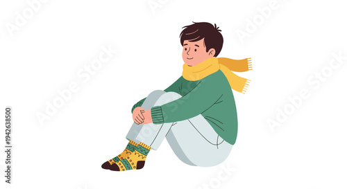 Young boy wearing a cozy green sweater and a yellow scarf sits comfortably while showcasing his patterned winter socks.