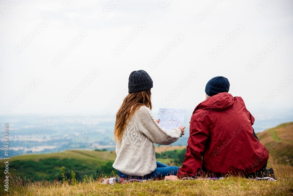 Fototapeta premium Couple exploring scenic landscape together.