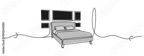 Bedroom bed positioned under wall art in modern minimal setting