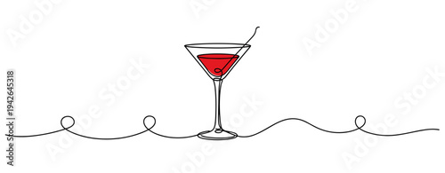 Martini glass holding cocktail on continuous line setting