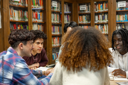 Diverse students collaborating learning together in library