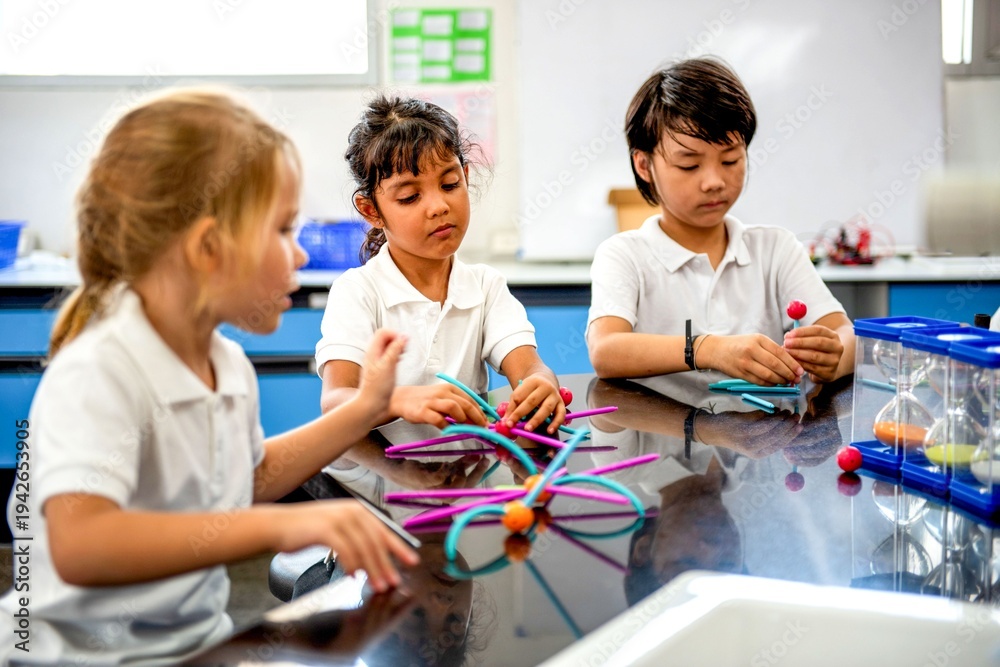 Fototapeta premium Children learning science together.