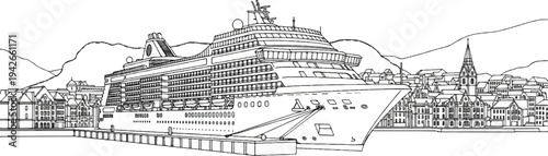 Large passenger vessel docked at a quaint European harbor town with mountains behind