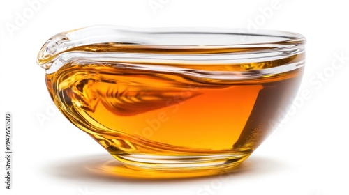 Glass bowl containing amber liquid