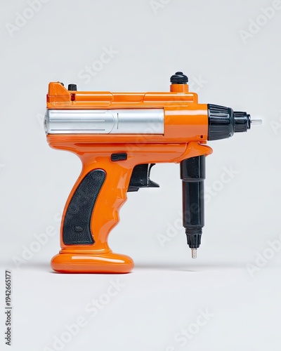 Orange gun-shaped power tool