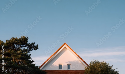 a suburban european house with a triangular roof