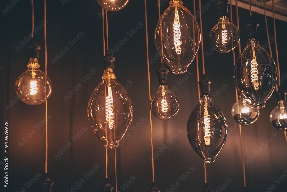 Fototapeta premium Background light bulb blurry background interior design bar table chair windows with copy space. Blurred background cafe coffee shop restaurant in shopping mall with light bokeh business event