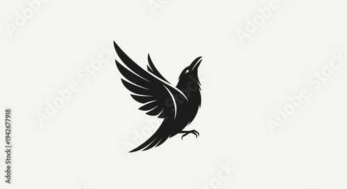 Elegant black bird in flight with spread wings, stylized raven or crow silhouette, minimalist graphic design element