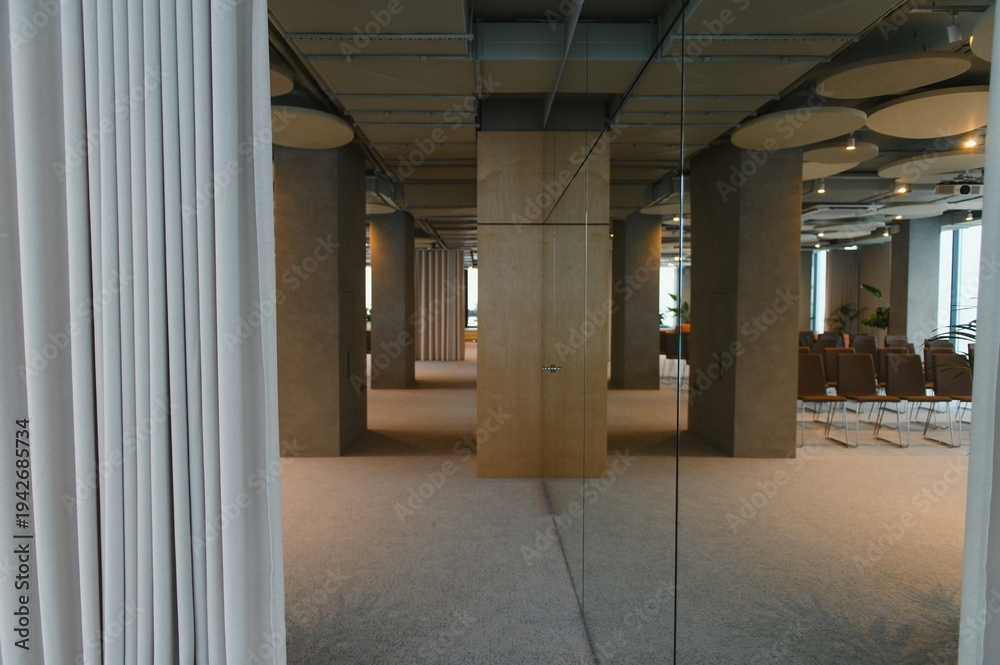 Fototapeta premium Modern office interior with meeting space and columns