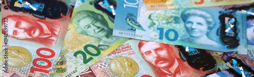 Wallpaper Mural New Zealand dollar money bills pile on table. New Zealand banknotes of NZD currency close up. Torontodigital.ca