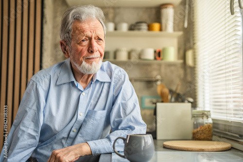 Senior man contemplating life with morning coffee