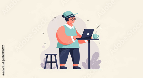 Person wearing a hat and glasses, working on a laptop with a coffee cup nearby