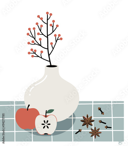 Still life arrangement of red apples star anise cloves and berry branch in vase checkered cloth