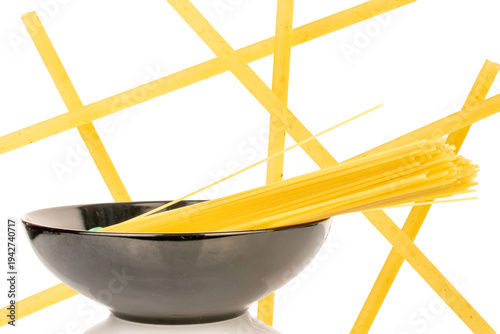 Photography Uncooked spaghetti isolated on white background, close-up.
