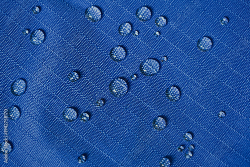 фотографія Water droplets on blue waterproof material