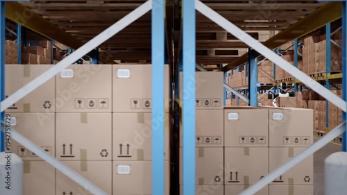 Wallpaper Mural Pan along a fully automated warehouse with AI-powered humanoid robots and agv robots transporting cardboard boxes. Future of industrial warehouse automation and AI robotics. 3d animation rendering Torontodigital.ca